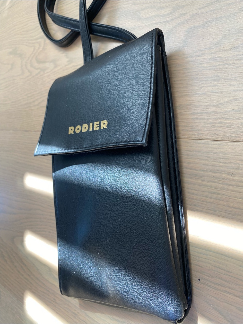 RODIER Black Mini Crossbody Pouch with Gold Logo